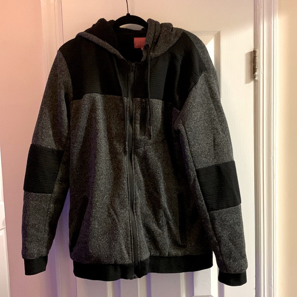 Black and gray Zip Up Hoodie With Zipper Pockets. 3 Pockets